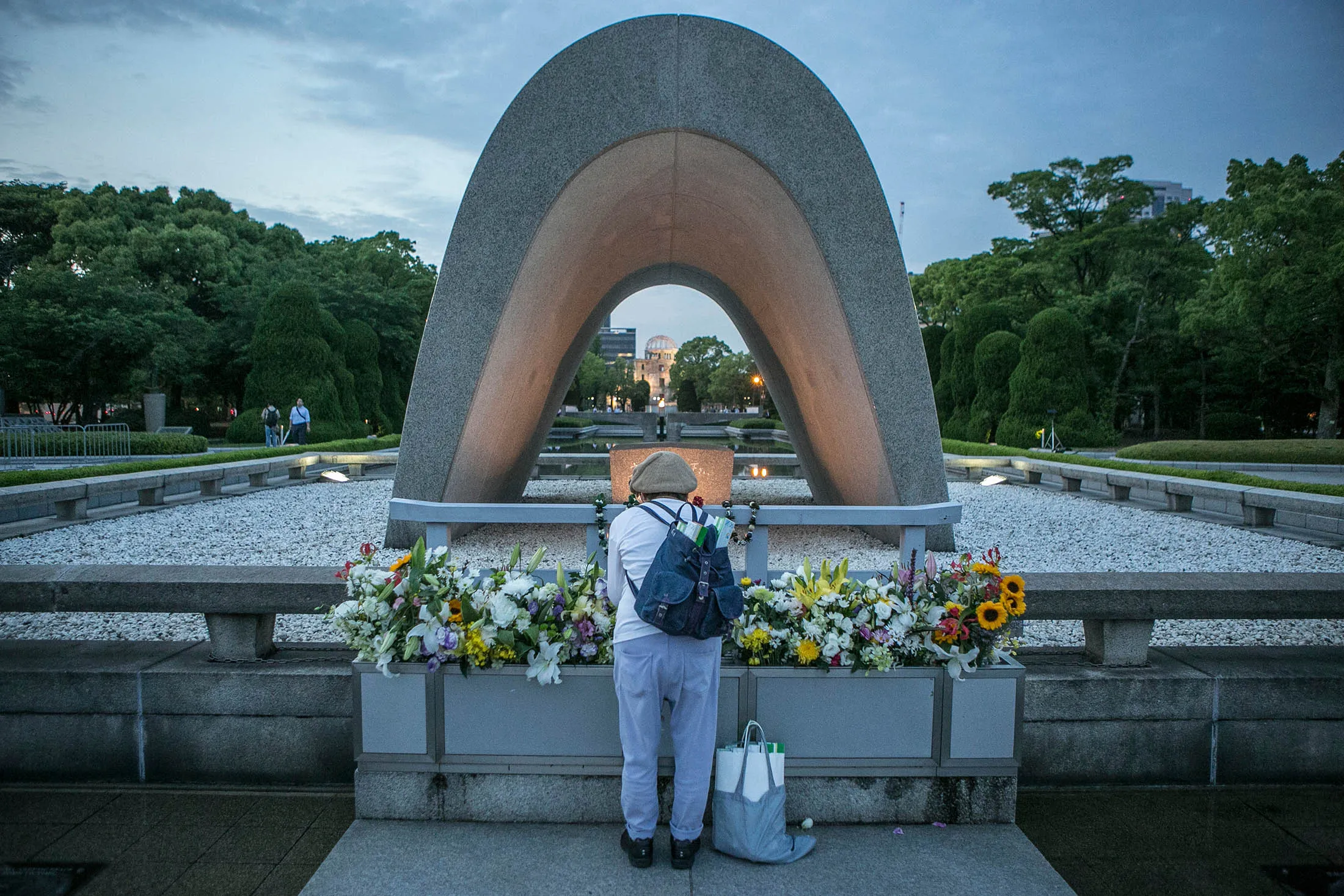 A woman pays respects at the arch inside Peace Memorial Park in Hiroshima. Making his final trip to Japan as president, Obama will pay his respects to the tens of thousands of Japanese killed by U.S. atomic weapons.
