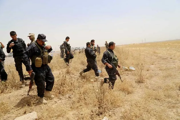 Kurdish Peshmerga forces and Iraqi special forces deploy outside Kirkuk on June 12