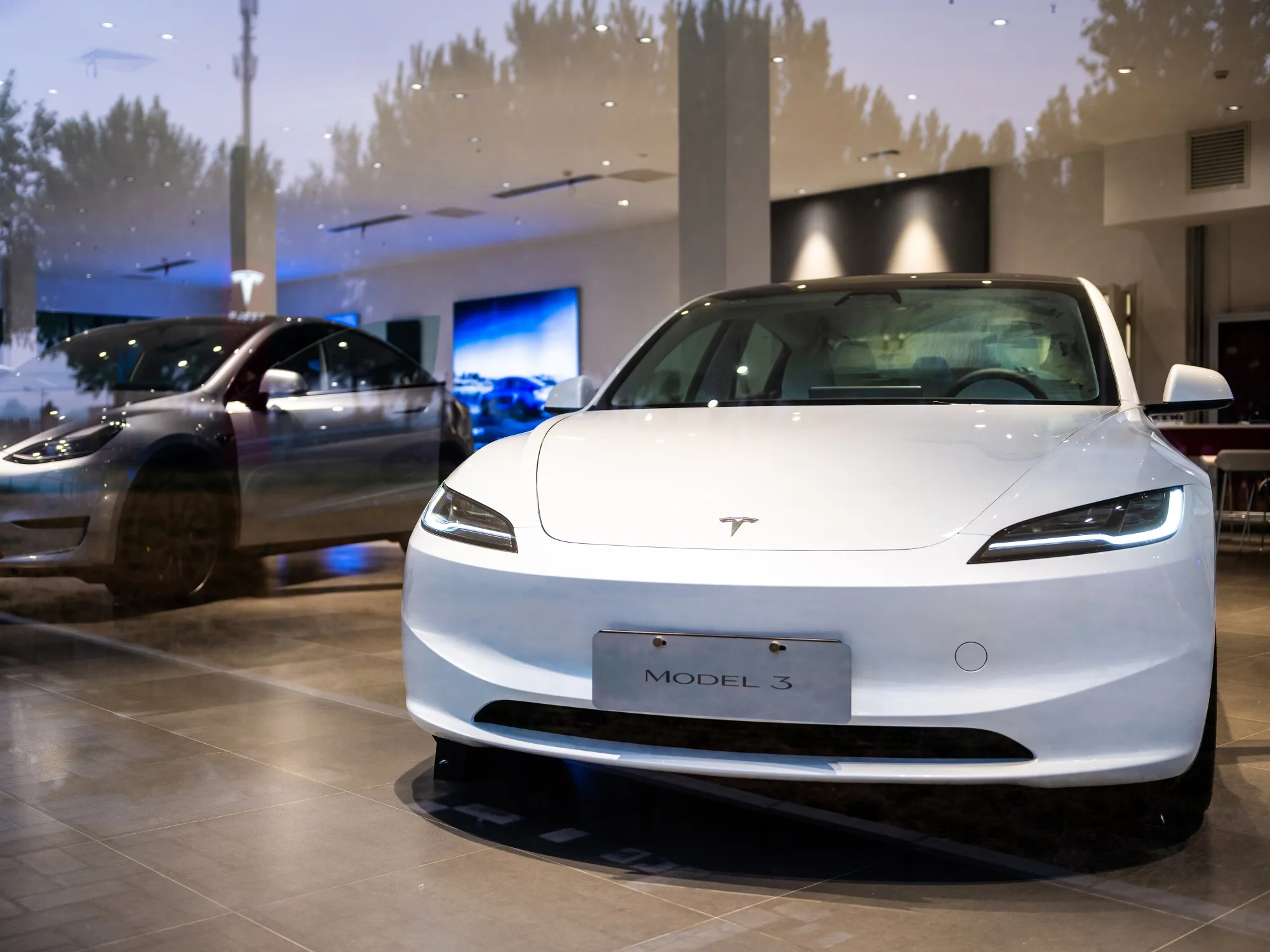 A Tesla Inc. Model 3 electric vehicle at a store in Beijing, China.
