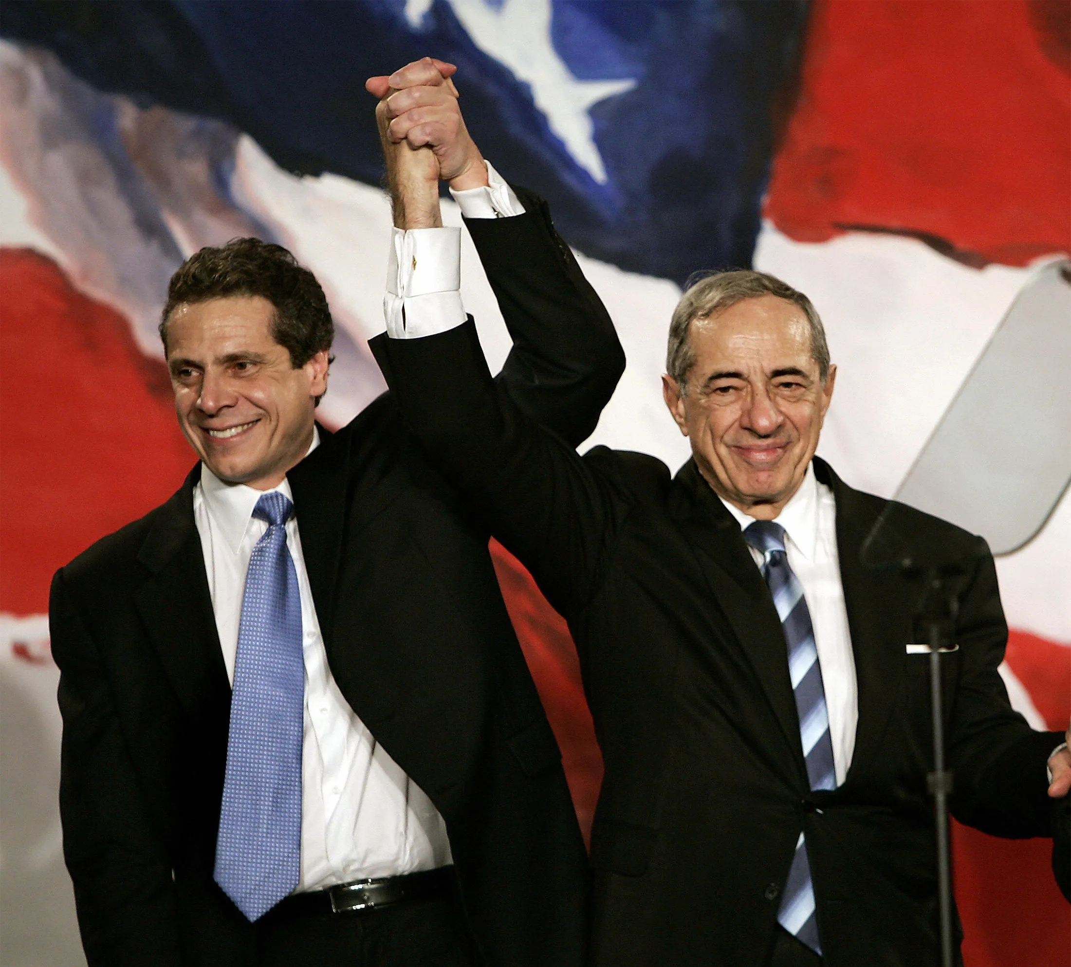 Then New York Attorney General Elect Andrew Cuomo, left,&nbsp;joins hands with his father former New York Governor Mario Cuomo during a rally in New York in&nbsp;2006.&nbsp;