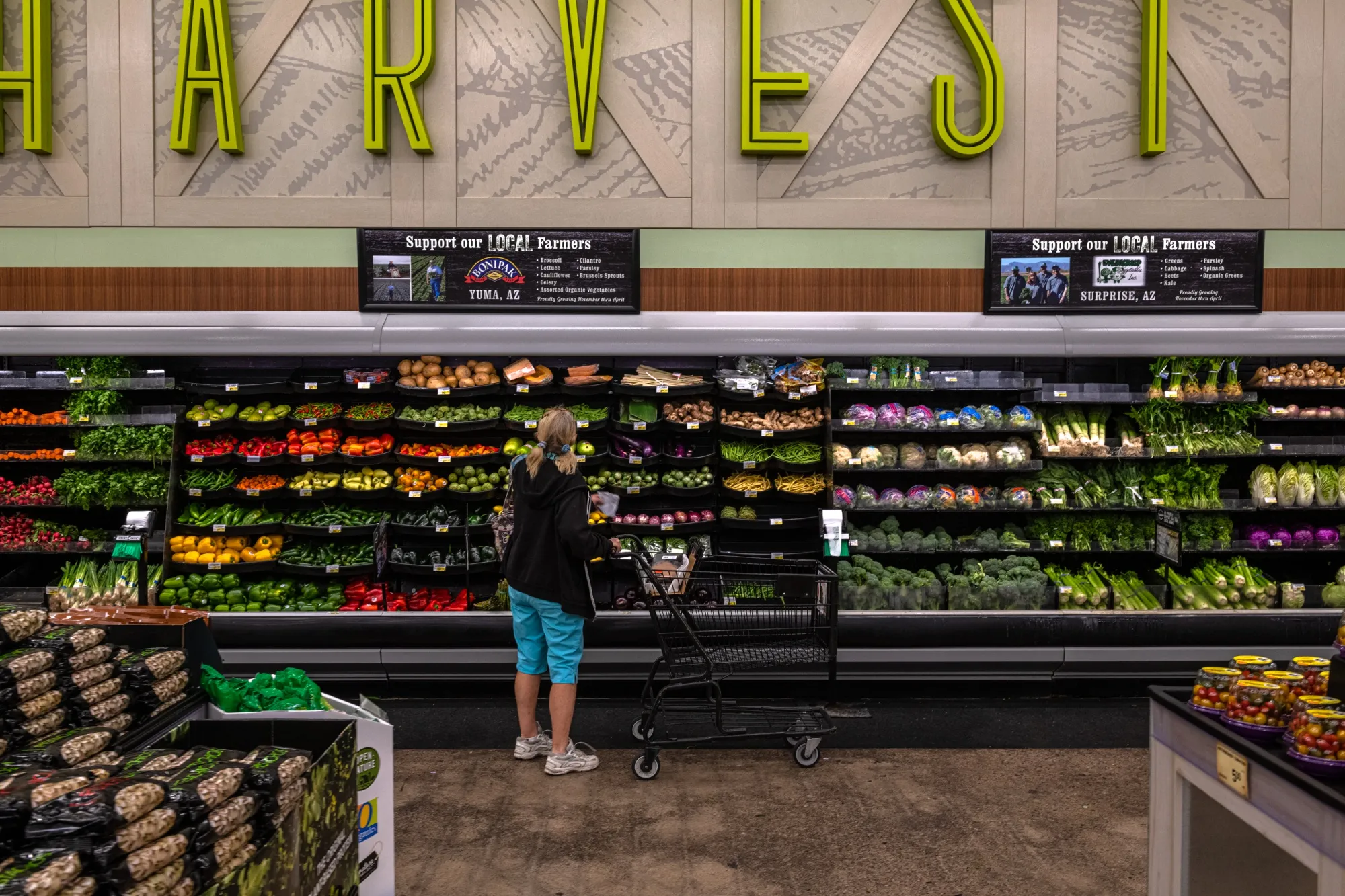 A customer views vegetables for sale at a&nbsp;grocery store in Scottsdale, Arizona.