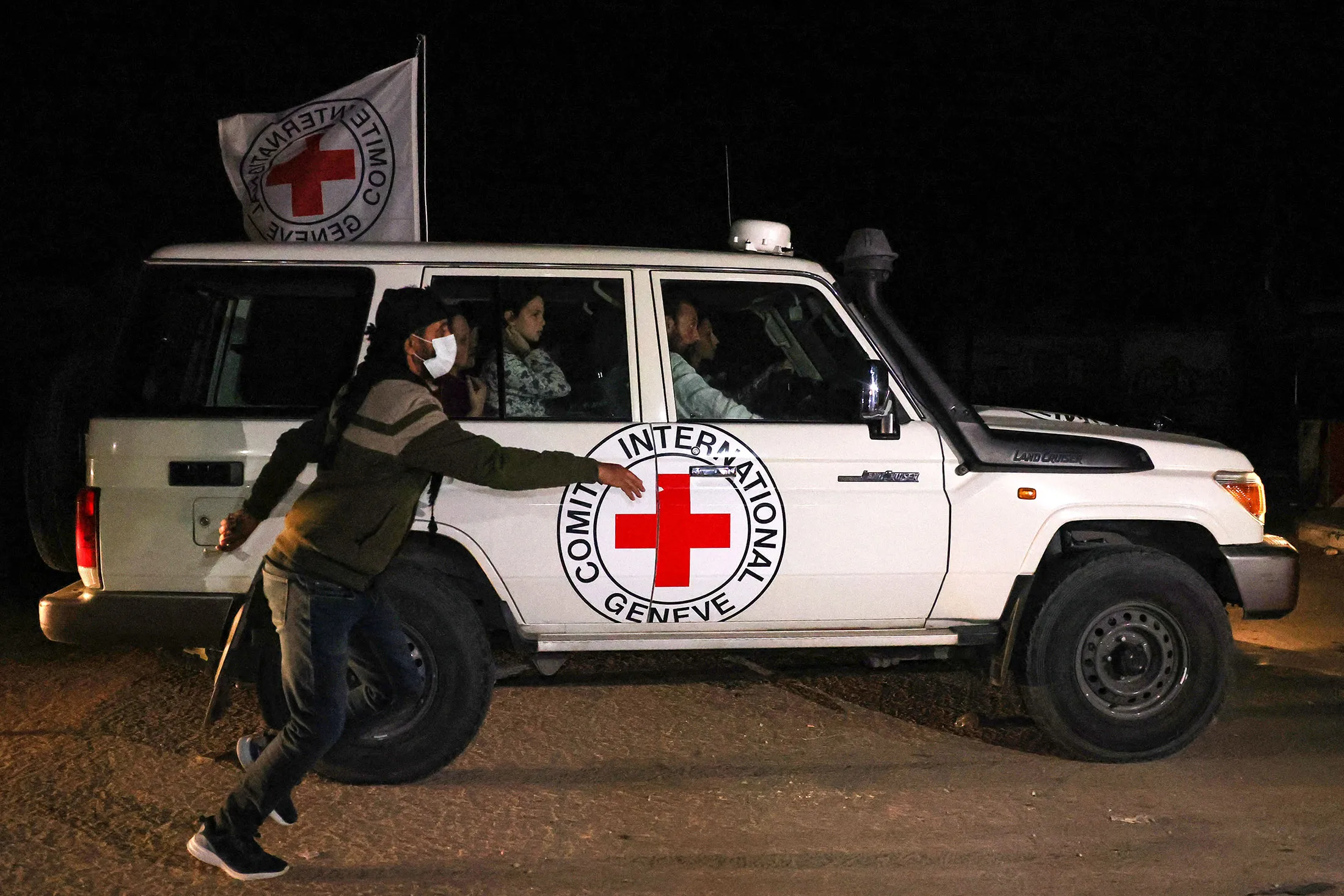 An International Red Cross vehicle reportedly carrying hostages released by Hamas drives towards the Rafah border point with Egypt, ahead of their transfer to Israel on Nov. 25.