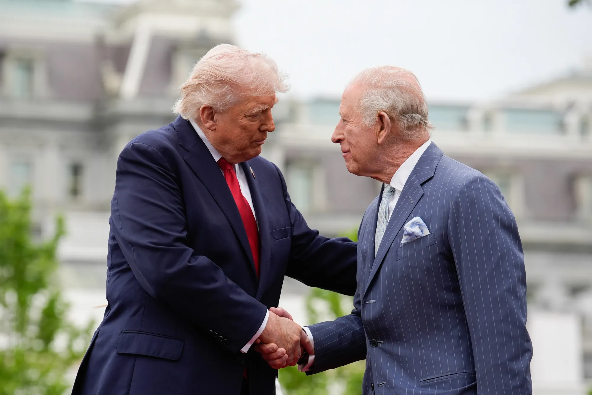 US President Donald Trump, left, and King Charles III shake hands during an arrival ceremony on the South Lawn of the White House in Washington on April 28.