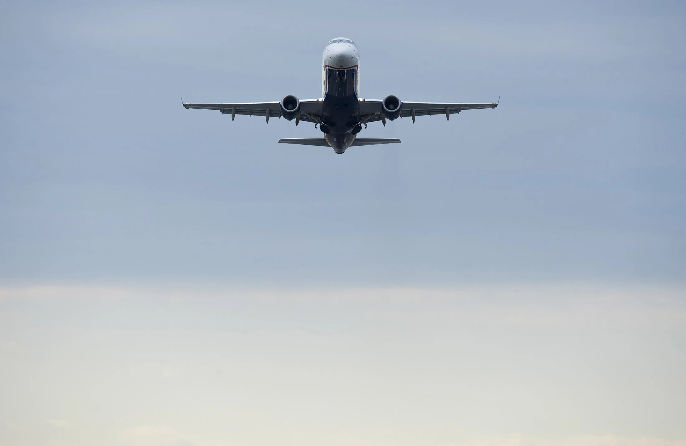 A US Airways Embraer E-175 airplane takes off from a runway at Ronald Reagan Washington National Airport in Arlington, Virginia.
