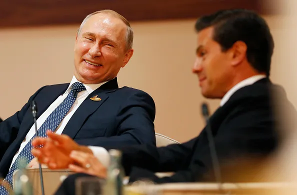 Why is this man smiling?
