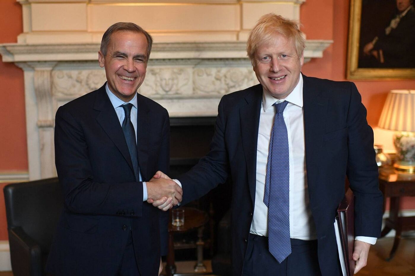 Mark Carney, left, is an adviser to U.K. Prime Minister Boris Johnson for the COP26 climate summit due to take place in November in Glasgow, Scotland