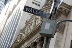 A Wall Street sign is displayed outside the New York Stock Exchange (NYSE) in New York, U.S.