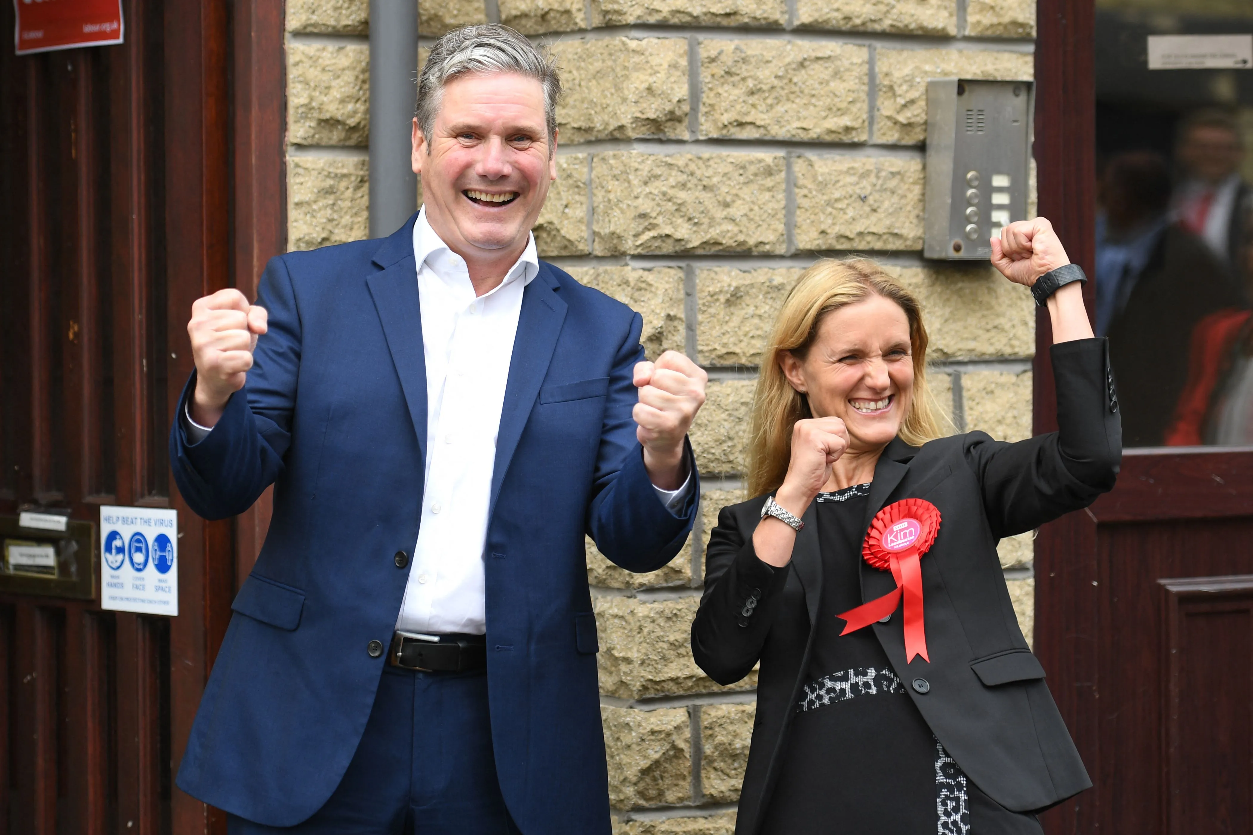 Britain's main opposition Labour Party leader Keir Starmer and Labour Party's Kim Leadbeater celebrate victory.