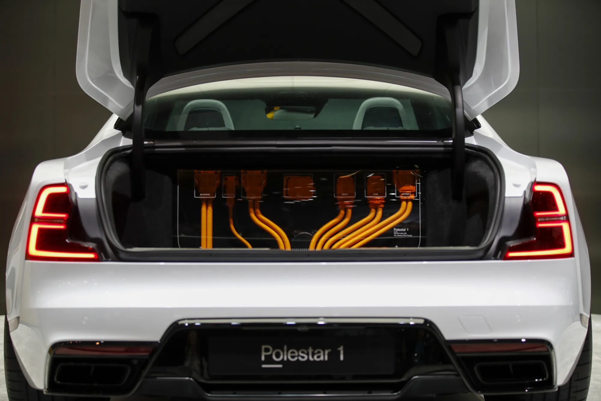 Cables sit in the trunk of a Polestar 1 electric automobile, manufactured by Volvo.