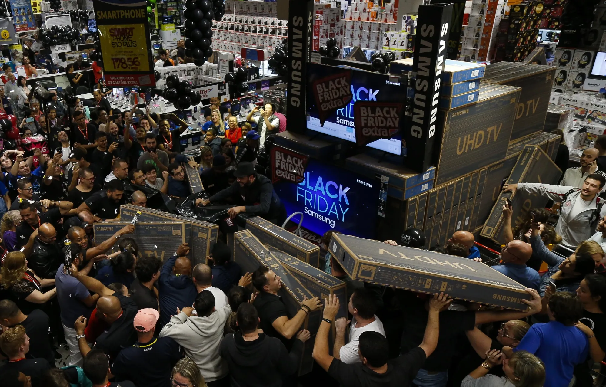 Shoppers buy televisions during a Black Friday event in Sao Paulo, on Nov. 28.