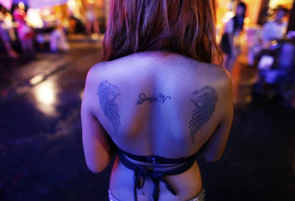 A Bangkok go-go dancer waits for customers.