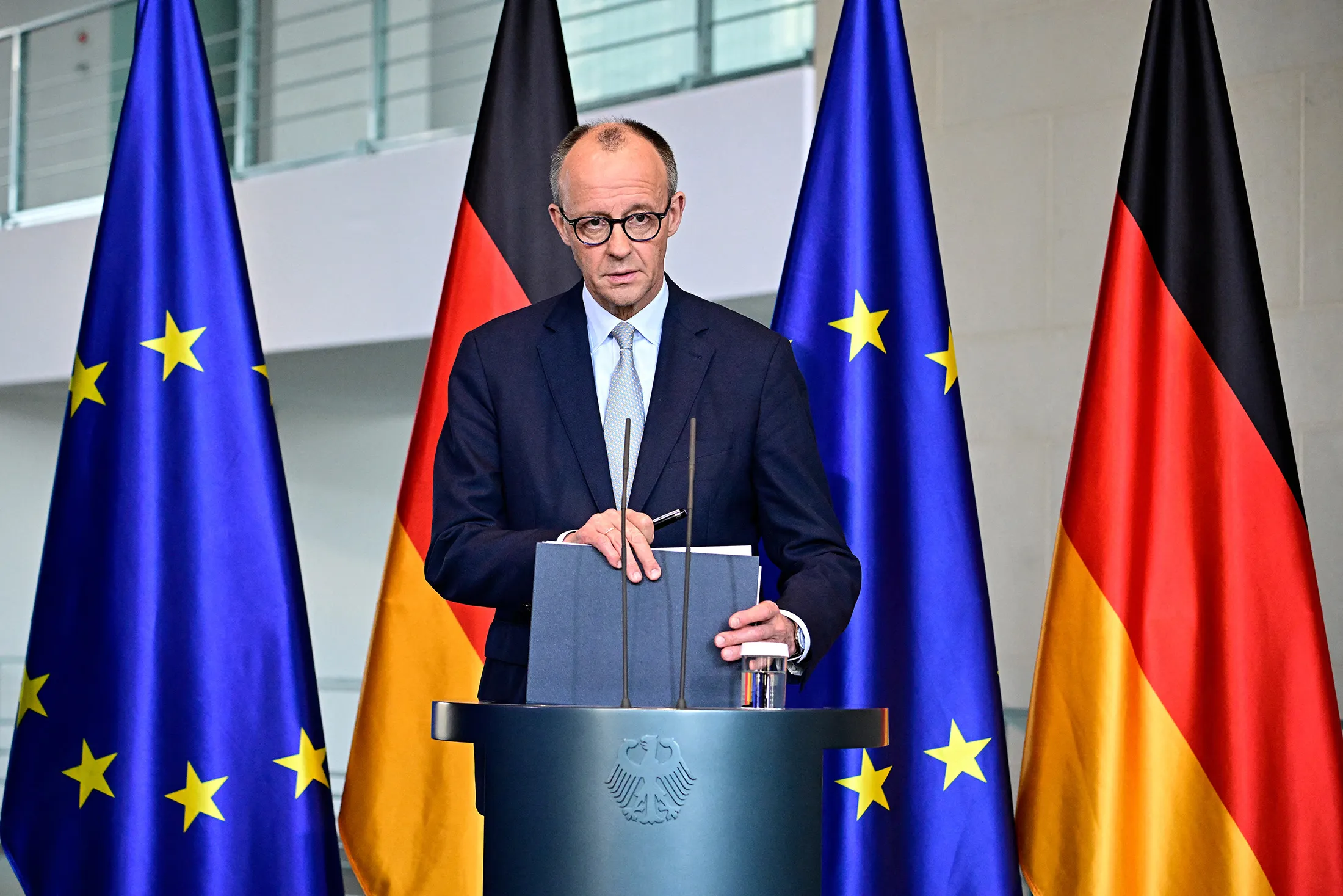 German Chancellor Friedrich Merz leaves after a press conference on the situation in the Middle East at the Chancellery in Berlin on March 1.