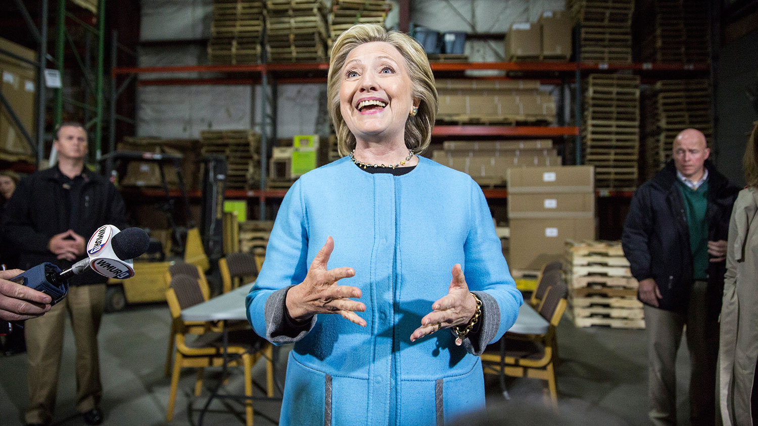 Democratic presidential hopeful and former U.S. Sectetary of State Hillary Clinton speaks with members of the media after a round trable discussion with employees of Whitney Brothers, an educational furniture manufacturer, April 20, 2015 in Keene, New Hampshire.

