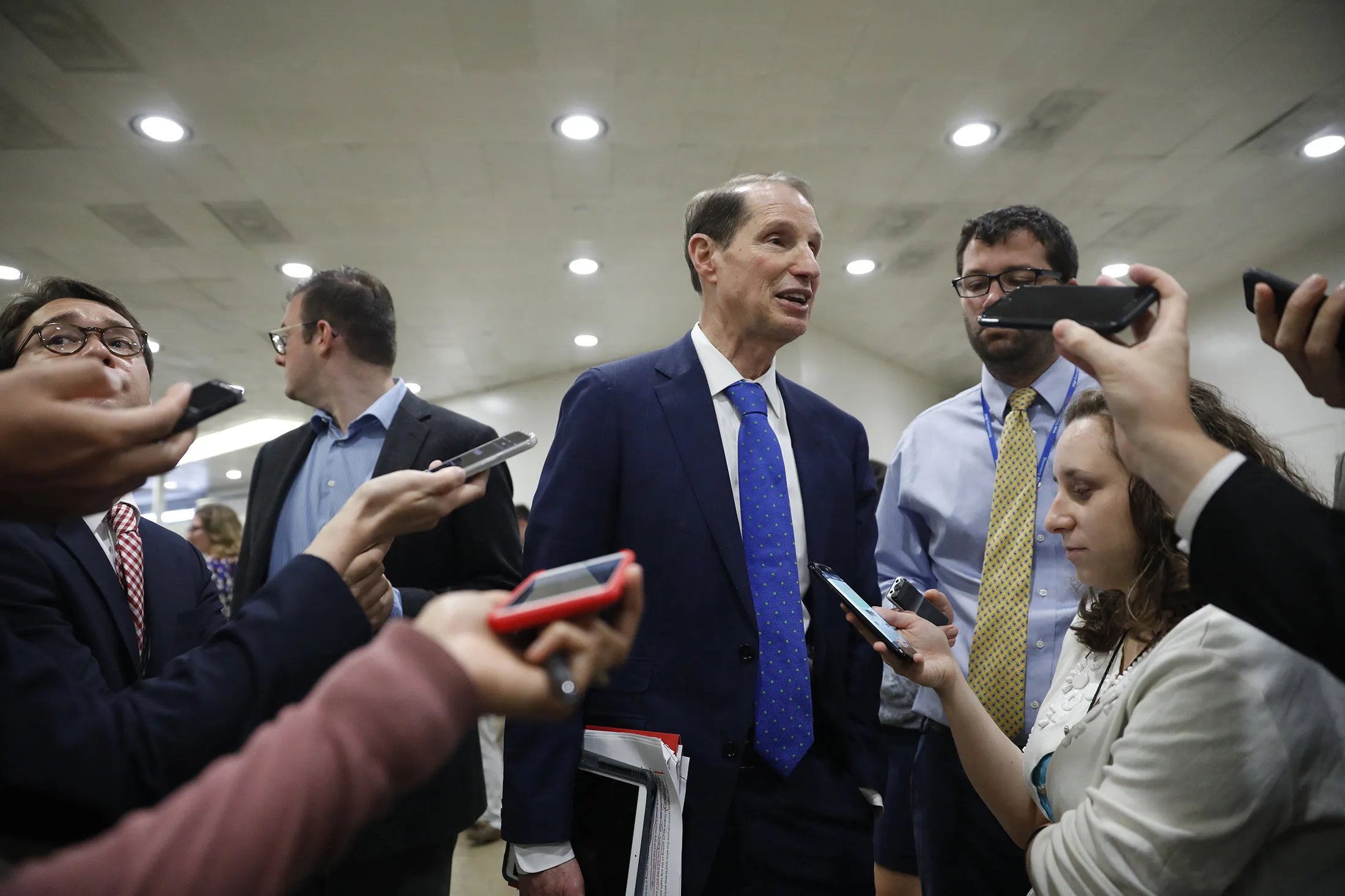 Sen. Ron Wyden (D-OR) speaks with reporters at the U.S. Capitol on Sept. 6.
