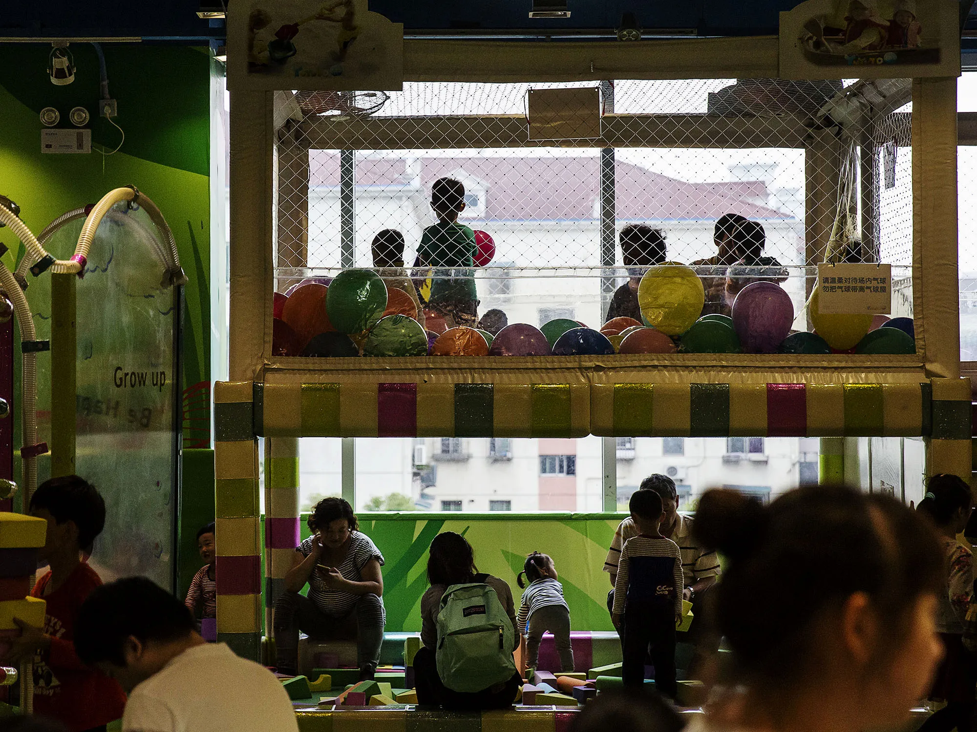 Children play inside an indoor playground at a mall in Shanghai.
