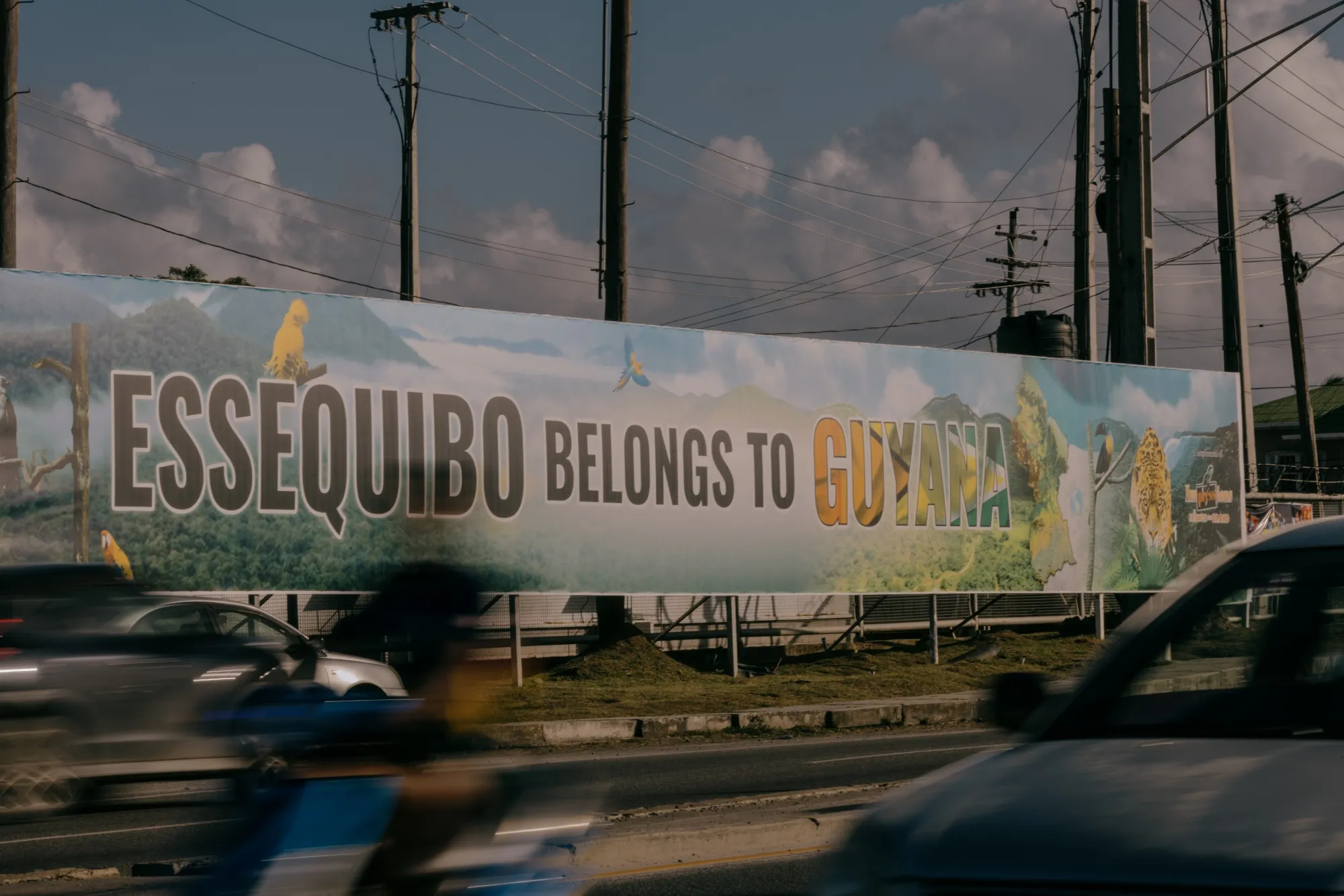 A sign that reads "Essiquibo Belongs to Guyana" displayed at the Madela Eccles roundabout in Georgetown, Guyana.