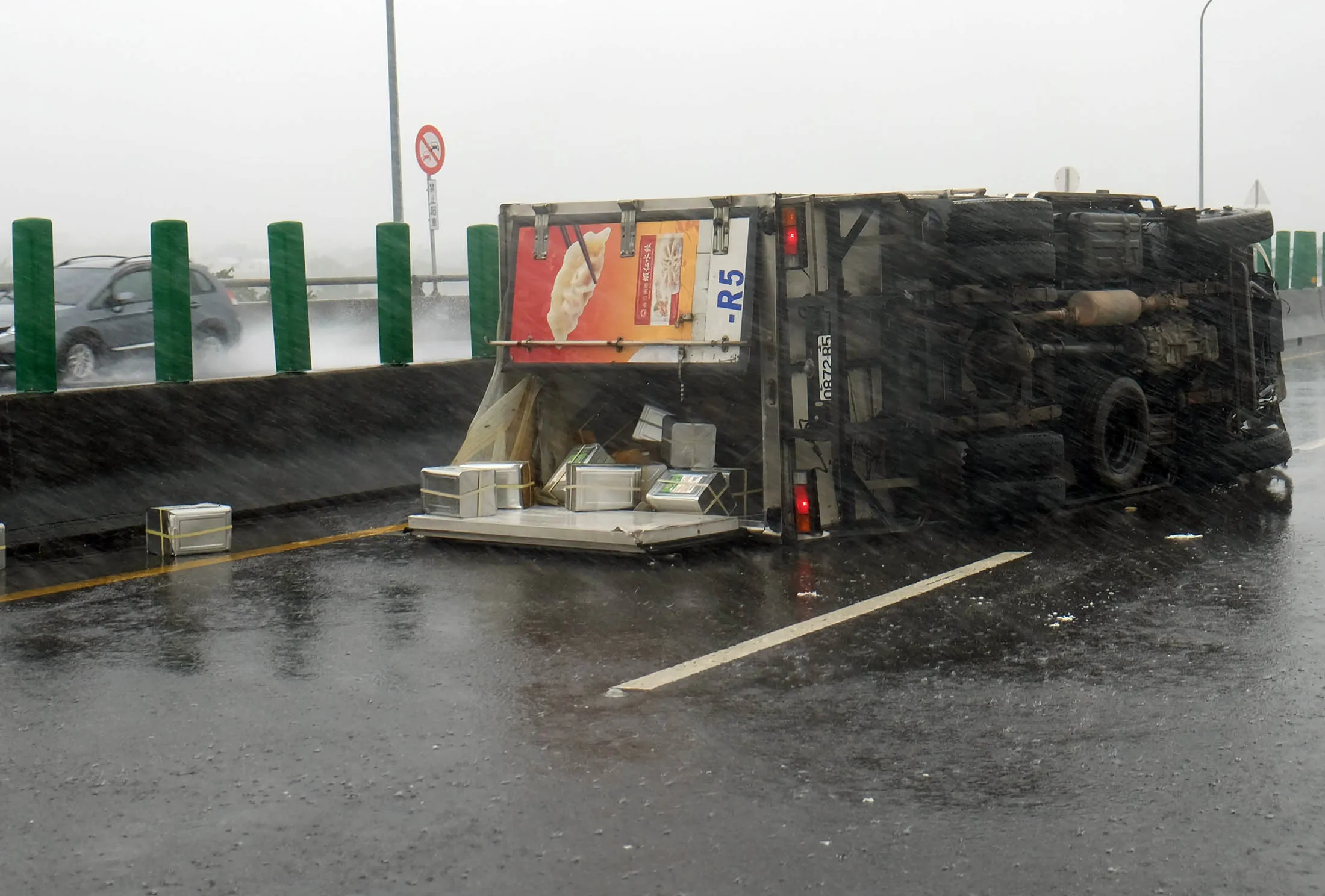 A truck is overturned in southern Pingtung county as Meranti hits southern Taiwan on Sept. 14.
