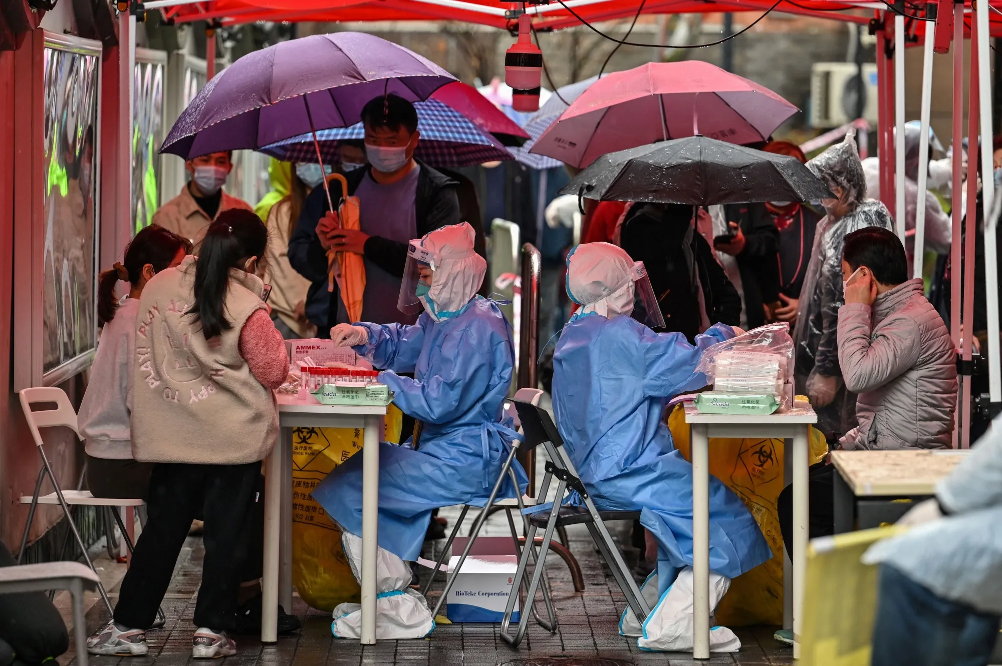 Residents in Shanghai&nbsp;are tested&nbsp;in a locked down neighborhood&nbsp;on March 17.