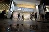 Pedestrians walk past a SoftBank Group Corp. store in Tokyo, Japan,.