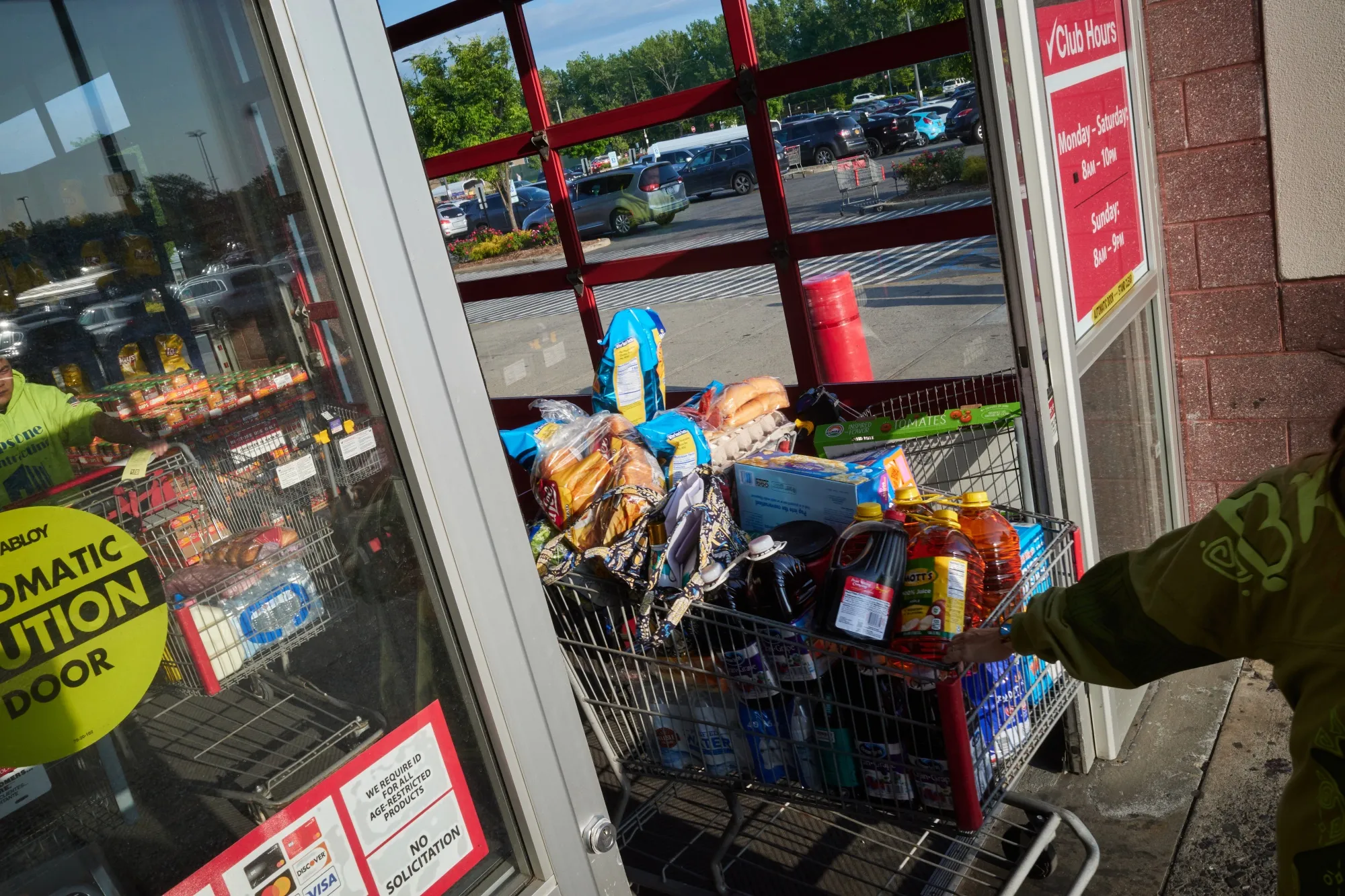 Shoppers exit a BJ's Wholesale Club location in the Queens borough of New York.
