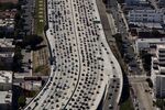 Vehicles sit in rush hour traffic on the Interstate 405 freeway in this aerial photograph taken over the Westwood neighborhood of Los Angeles, California, U.S.