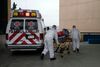 First responders transport a woman with respiratory problems at the IMSS Hospital General Regional 1 in Tijuana, Baja California State, Mexico, on May 10, 2020 during the COVID-19 novel coronavirus pandemic. - Baja California State closed its cemeteries on Mother's Day to avoid crowds during the coronavirus pandemic. (Photo by Guillermo ARIAS / AFP) (Photo by GUILLERMO ARIAS/AFP via Getty Images)