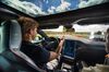 A test driver removes his hands from the steering wheel of a Tesla Model S in Boxberg, Germany, on July 4, 2017.