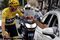 Great Britain's Christopher Froome wearing the overall leader's yellow jersey toats with champagne as he takes the start of the 103 km twenty-first and last stage of the 104th edition of the Tour de France cycling race on July 23, 2017 between Montgeron and Paris Champs-Elysees. / AFP PHOTO / POOL / BENOIT TESSIER (Photo credit should read BENOIT TESSIER/AFP/Getty Images)