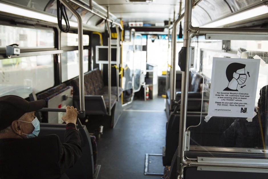 A sign advising passengers to wear face masks is displayed on a New Jersey Transit bus in Atlantic City.