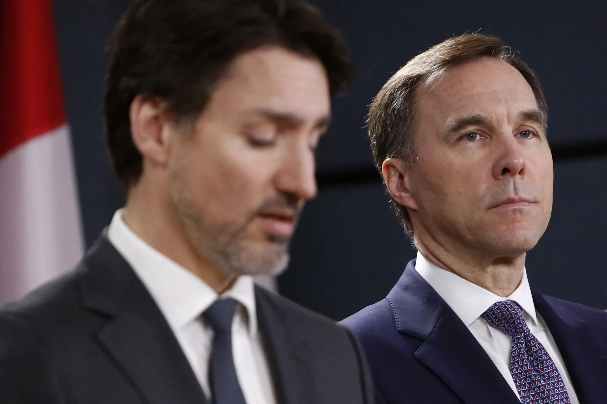 Justin Trudeau and Bill Morneau speak at an Ottawa news conference in March.