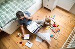 Father with his little son working from home