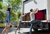 Yound Adults opening back of moving truck