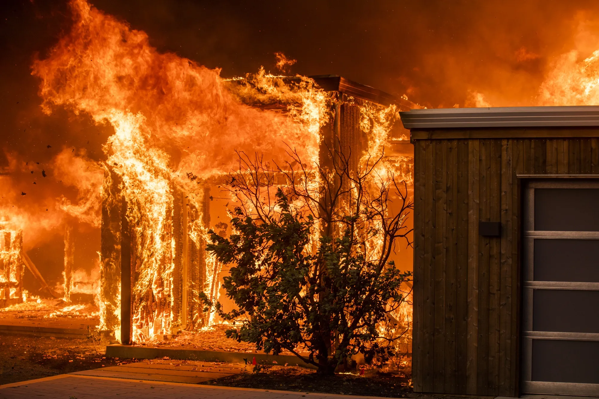Flames engulf a home during the Kincade fire in Healdsburg, California, on Oct. 27.