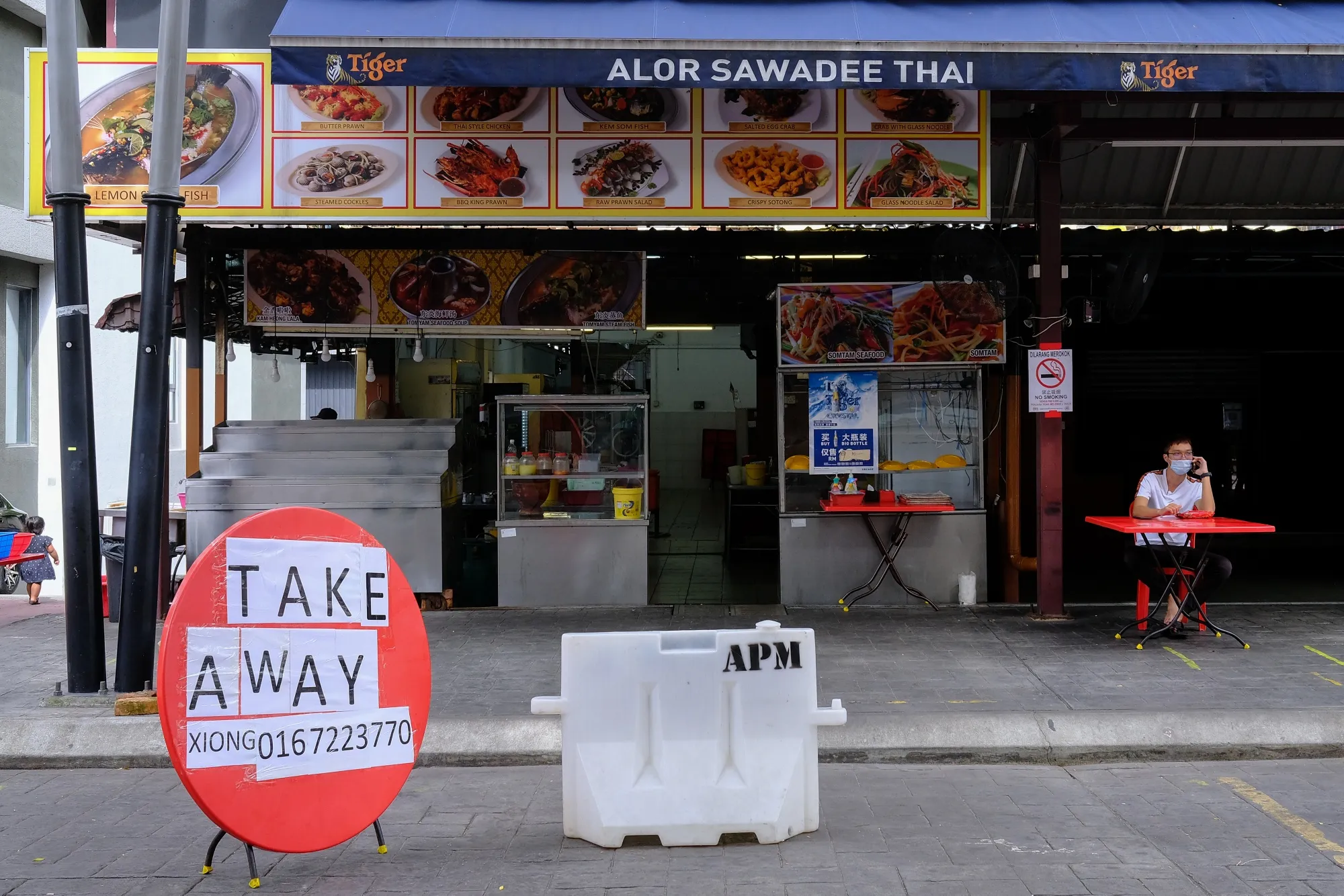 A sign for take-away is displayed outside a restaurant during a nationwide state of emergency in Kuala Lumpur, on&nbsp;Jan, 13.