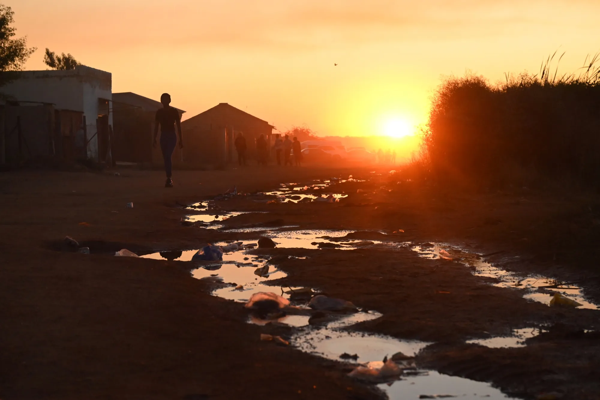 Puddles of sewage water&nbsp;on the side of a dirt road in&nbsp;the Kanana informal settlement in&nbsp;Hammanskraal, on June 10.