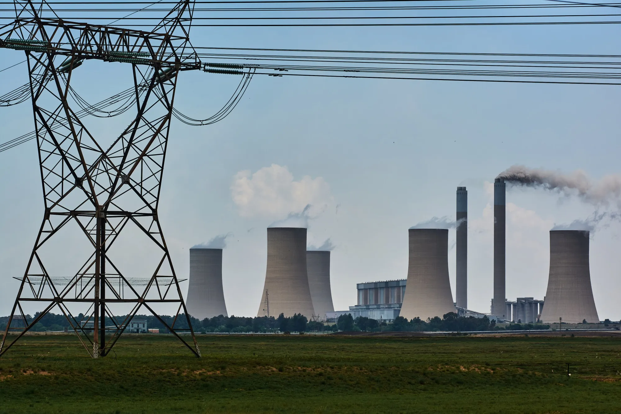 A electricity transmission tower close to the Eskom Holdings SOC Ltd. Lethabo&nbsp;power station in Vereeniging, South Africa.