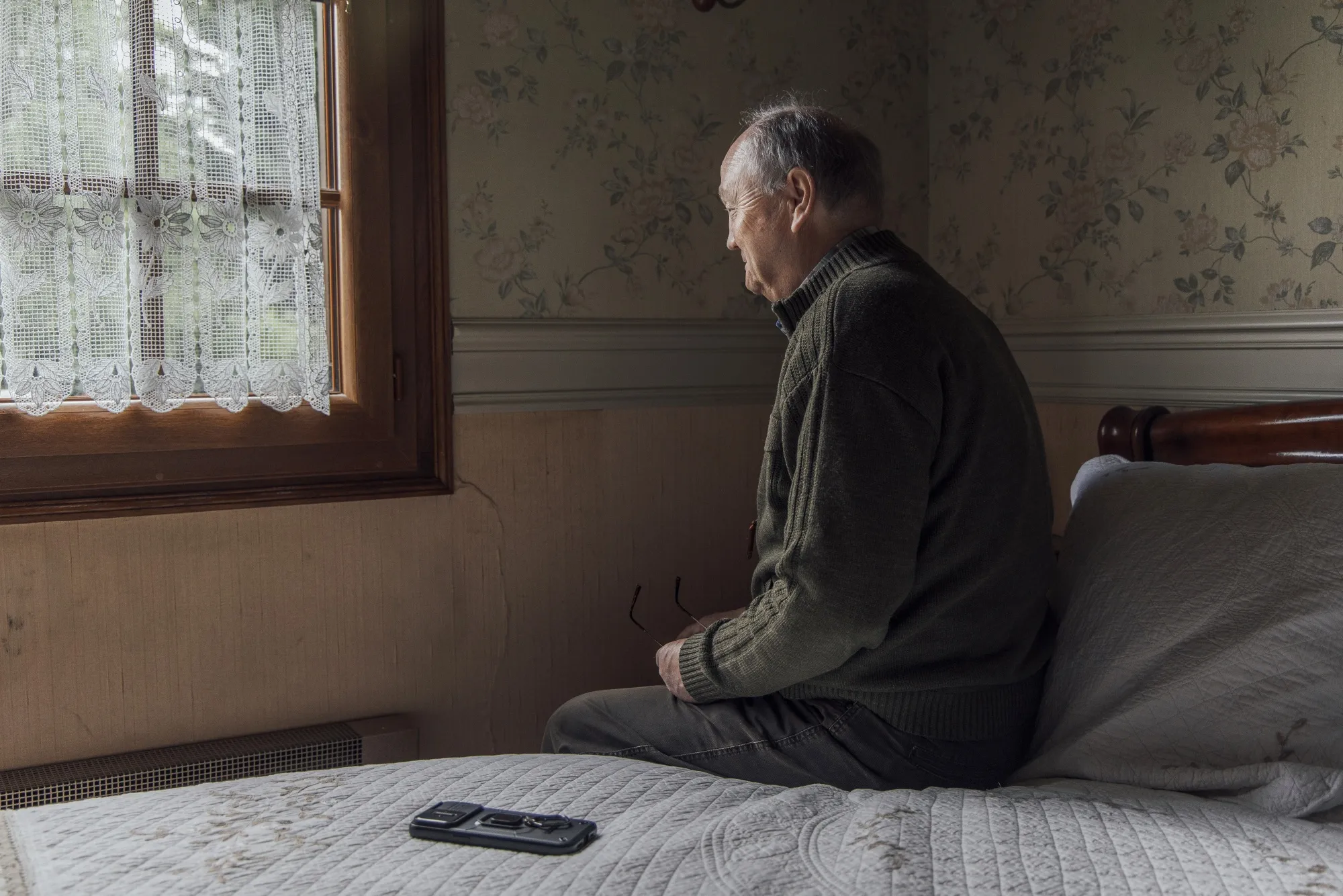 Presles-en-Brie homeowner Bernard Weisse looks at cracks in a bedroom&nbsp;wall&nbsp;of his village home on the outskirts of Paris on June 2.&nbsp;