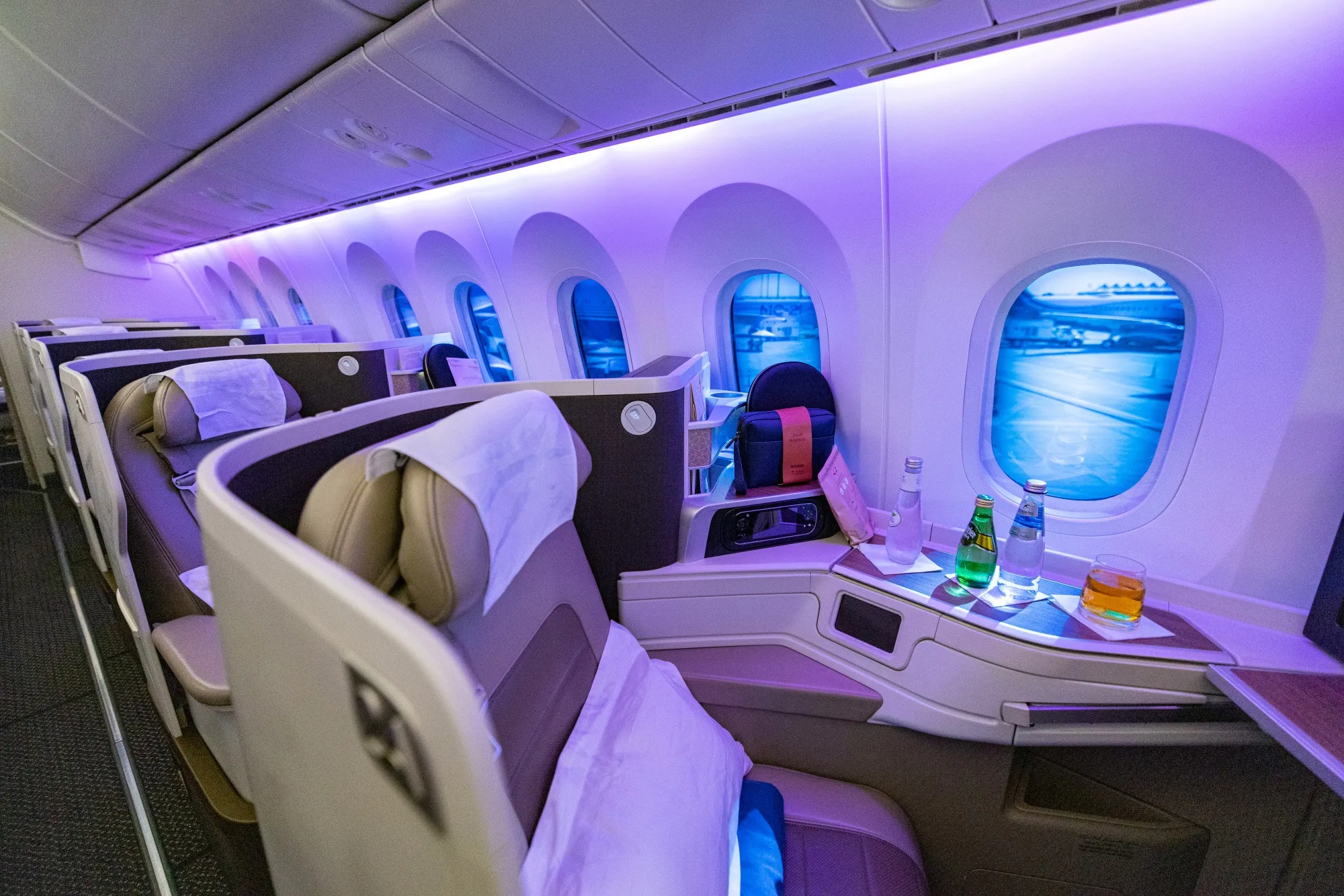 Seats for business class passengers aboard a Boeing 787-10 passenger aircraft, operated by Saudia Airlines.