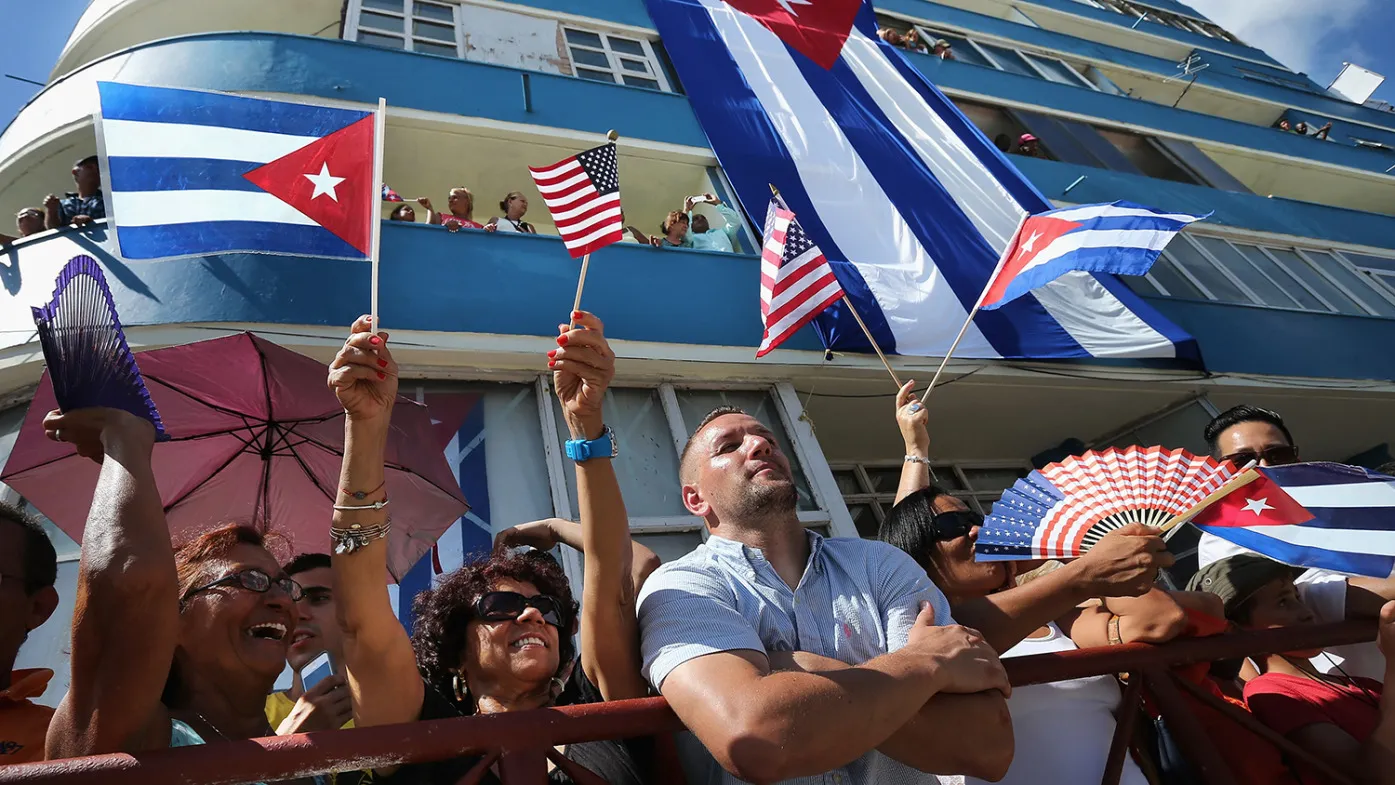 Hundreds of Cubans and visitors from other countries gather across the street from the newly reopened U.S. Embassy to observe the flag-raising ceremony August 14, 2015 in Havana, Cuba.
