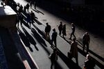 Pedestrians walk along Wall Street near the New York Stock Exchange&nbsp;in New York.