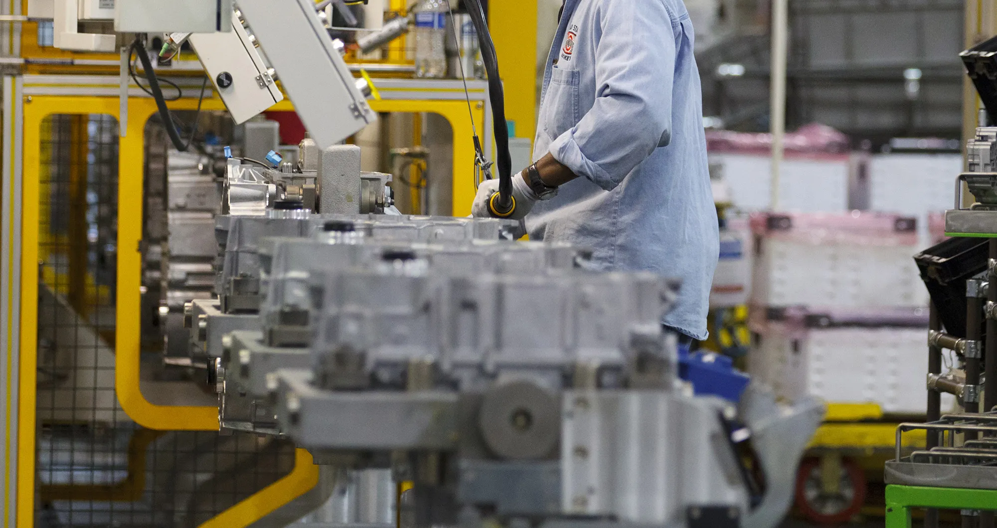 A worker assembles a transmission at the GM plant in Toledo, Ohio.