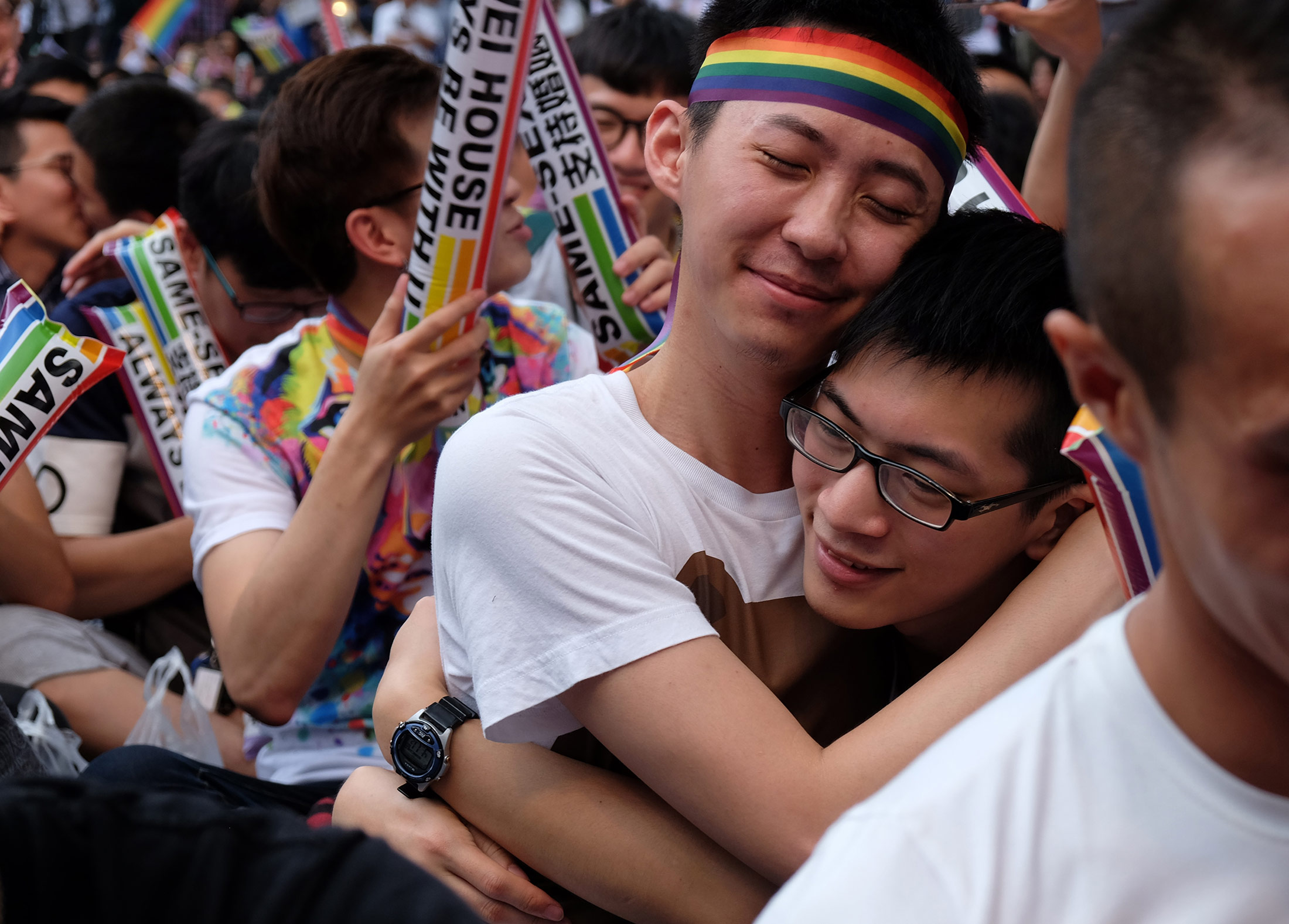 Same-sex activists hug outside the parliament in Taipei on May 24.
