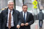 Douglas Hodge, right, arrives at federal court in Boston, Massachusetts, on Feb. 7. 