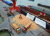 Workers load imported soybeans onto trucks at a port in Nantong in China's eastern Jiangsu province on April 4, 2018.