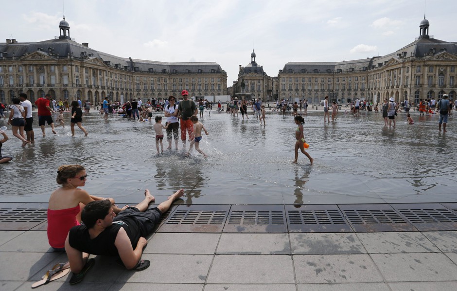 People paddling in Place de la Bourse, Bordeaux, a city whose mayor recently appealed to the E.U. for help controlling Airbnb.