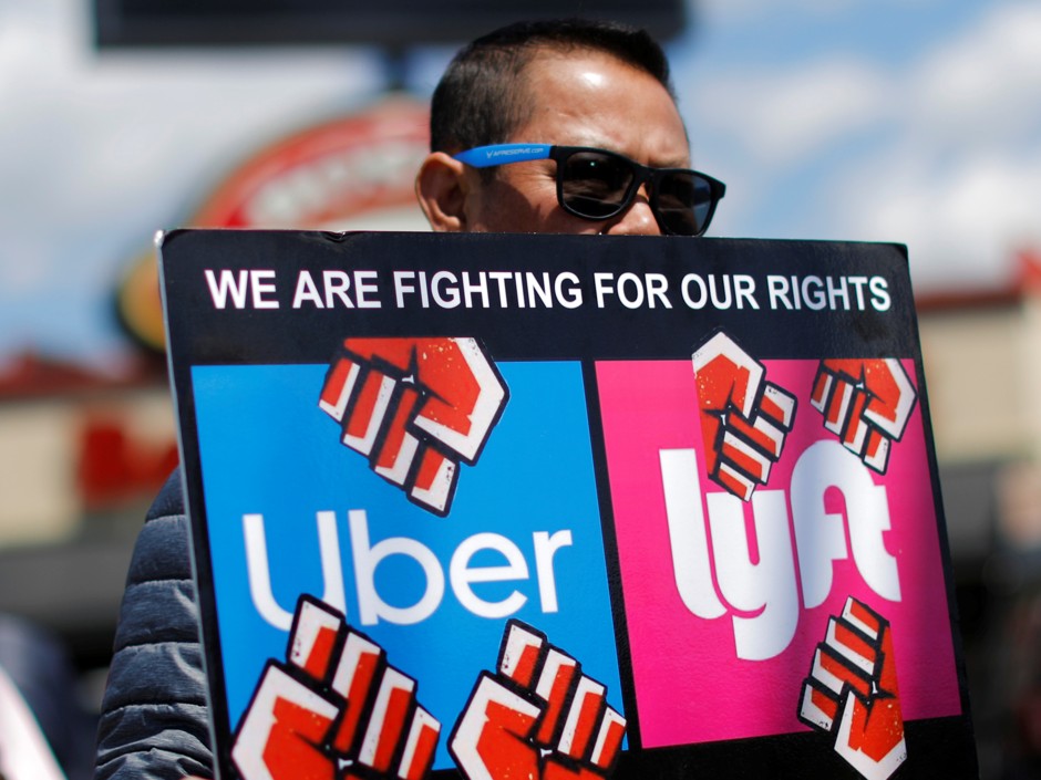 Uber and Lyft drivers protest during a day-long strike outside Uber's office in Saugus, Massachusetts, on May 8, 2019