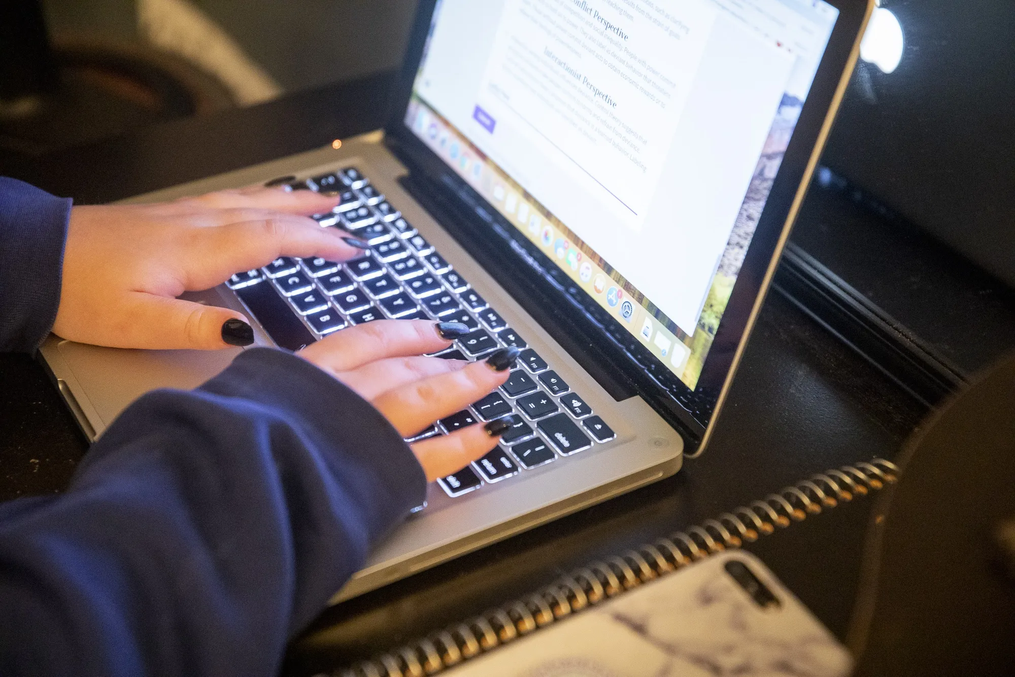 A student works on a laptop computer.