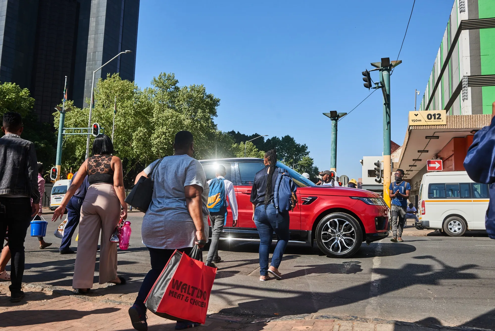 Shoppers cross a street in the central business district&nbsp;of Pretoria, South Africa, on&nbsp;Sept. 14.&nbsp;