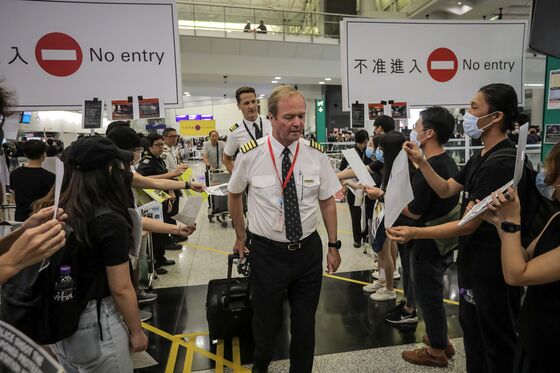 Stranded, Squeezed and Seething as Hong Kong Airport Shuts Down