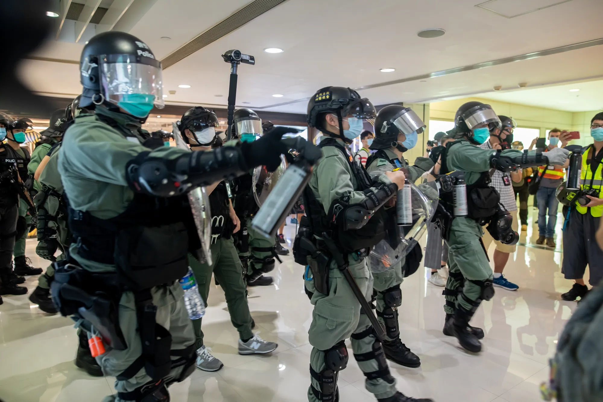 Riot police attempt to disperse crowds inside Harbour City shopping mall, on May 10.